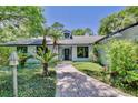 Inviting single-story home with a brick pathway leading to the front door at 183 Parsons Rd, Longwood, FL 32779