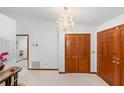 Bright foyer features tile flooring, closet, and view of the laundry room at 2018 N Normandy Blvd, Deltona, FL 32725