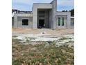 View of construction site showing partially completed house with concrete framing, window openings, and a prominent entryway at 26019 Estates Ridge Dr, Sorrento, FL 32776