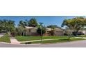 Corner lot featuring a well-kept lawn and a charming single-story home at 3121 Thistlehill Drive, Winter Park, FL 32792