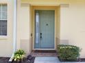A welcoming front entrance with sidelight window at 3658 Oakdale Cir # 100, Oviedo, FL 32765