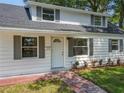 Inviting home with freshly landscaped front yard, gray shutters, and a classic white front door at 1082 Hamilton Ave, Longwood, FL 32750