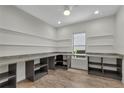 Spacious pantry featuring granite countertops, abundant shelving, and convenient storage solutions at 11741 Savona Way, Orlando, FL 32827