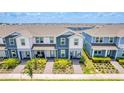 Aerial view of the townhouses showing rooflines and landscaping at 14250 Sapelo Beach Dr, Orlando, FL 32827