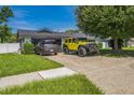 This single-story home features a well-maintained lawn, driveway, and ample parking space at 1460 Spring Ridge Cir, Winter Garden, FL 34787