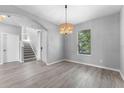 Bright living room featuring hardwood floors, neutral walls, and natural light at 14835 Old Thicket Trce, Winter Garden, FL 34787