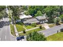 An aerial view showcasing a charming home with a lush lawn, nestled in a serene residential neighborhood at 1919 E South St, Orlando, FL 32801