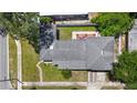 Aerial view showcasing a well-maintained home with a dark gray shingle roof and a neat yard, set in a quiet neighborhood at 1919 E South St, Orlando, FL 32801