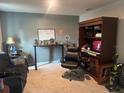 Bedroom featuring neutral-toned walls, a desk, an office chair and cabinet at 268 Fiddlewood Ct, Davenport, FL 33837