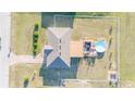 Aerial view showcases a lovely backyard with a pool, a deck, and a fenced yard at 2801 Sw 139Th St, Ocala, FL 34473