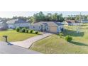 Lovely single-story home featuring a long driveway and a well-manicured front lawn at 2801 Sw 139Th St, Ocala, FL 34473