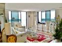 Bright living room features floor to ceiling windows, stylish furniture, and a stunning view at 400 E Colonial Dr # 1609, Orlando, FL 32803