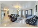 Comfortable living room with tile flooring, neutral tones, and lots of natural light at 4021 Queen Anne Dr, Orlando, FL 32839