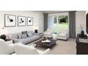 Bright living room with neutral walls, a sofa, armchairs, decorative wall art, and a glass sliding door at 4317 Riverbend Blvd, Haines City, FL 33844