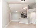Cozy living area featuring neutral walls, tile floors, and an inviting kitchen bar at 4528 Commander Dr # 2033, Orlando, FL 32822
