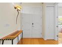 Spacious foyer featuring double doors, hardwood floors, and an accent table with elegant lighting at 548 S Hyer Ave # 1, Orlando, FL 32801