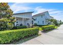Charming single-story home with covered porch and meticulously maintained front yard at 8518 Nemours Pkwy, Orlando, FL 32827