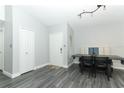 Bright dining area with modern flooring, wainscotting, and a built-in dining nook at 1077 Dees Dr, Oviedo, FL 32765