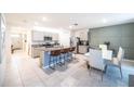 Spacious kitchen with a breakfast bar, stainless steel appliances, and modern cabinetry at 1791 Hackberry St, Clermont, FL 34715