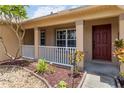 Welcoming front porch with lovely landscaping, offering great curb appeal at 2407 Accord Ter, Kissimmee, FL 34758