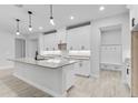 Bright kitchen featuring white cabinets, granite countertops, and an elegant mud room at 30369 Apricot Ave, Eustis, FL 32736