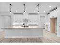 Bright kitchen featuring white cabinets, granite countertops, and modern pendant lighting at 30369 Apricot Ave, Eustis, FL 32736
