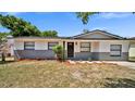 Well-maintained single-story home with manicured landscaping and a welcoming front entrance at 3397 Janet St, Apopka, FL 32712