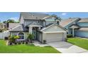 Attractive two-story home showcasing a manicured lawn and welcoming entrance at 485 Whittingham Pl, Lake Mary, FL 32746