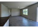 Spacious living area with tile flooring, natural light, and sliding door access to outside at 5350 Pine Lilly Dr, St Cloud, FL 34771