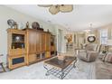 Comfortable living room with stylish furnishings, neutral color palette, and seamless transition to other living spaces at 636 Grand Canal Dr, Kissimmee, FL 34759