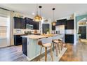 Beautiful kitchen with dark cabinets, granite countertops, and island seating, creating a functional space at 8256 Bayview Crossing Dr, Winter Garden, FL 34787