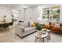 Tastefully decorated living room with large windows, modern furniture, and stylish decor at 1327 Tarflower Dr, Winter Springs, FL 32708