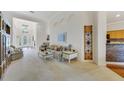 Bright living room with high ceilings, arched doorways, and neutral carpet at 1515 Cherry Lake Way, Lake Mary, FL 32746