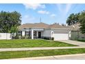 Well-maintained home with a lush green lawn and inviting curb appeal at 15411 Taurus Ct, Mascotte, FL 34753