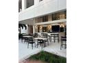 The patio area has tables, chairs, stools and a serving bar, great for outdoor entertainment at 15695 Grove Resort Ave # 4308, Winter Garden, FL 34787