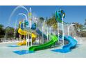 Colorful splash pad area with water slides and playful water features for Gathering fun at 15695 Grove Resort Ave # 4438, Winter Garden, FL 34787
