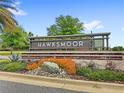 Hawksmoor community sign surrounded by vibrant plants and lush greenery at 15946 Marina Bay Dr, Winter Garden, FL 34787