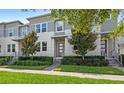 Attractive townhome exterior showcasing lush landscaping and a well-maintained facade at 15946 Marina Bay Dr, Winter Garden, FL 34787
