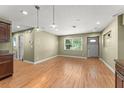 Bright living room featuring wood floors, a window view, recessed lighting, and neutral paint colors at 17 S Aurora Dr, Apopka, FL 32703