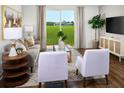 Inviting living room with neutral furniture, stylish decor, and a large sliding glass door for natural light at 2502 Linda Knoll Ln, Bartow, FL 33830