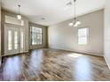 Bright living room features hardwood floors, high ceilings, and lots of natural light at 2528 Double Tree Pl, Oviedo, FL 32766