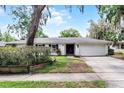 Well-maintained one-story home with a charming front exterior and landscaped yard at 2666 Derbyshire Rd, Maitland, FL 32751