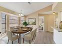 Inviting dining room featuring a bay window, modern chandelier and space for seating six at 2880 Trenton Ln, Deltona, FL 32738