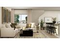 Inviting living room with a comfortable sectional sofa and stylish decor at 2883 Transformation Way, Clermont, FL 34714
