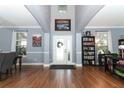 Spacious foyer with high ceilings, hardwood floors, and a decorative front door at 319 Morning View Dr, Winter Garden, FL 34787
