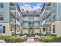 Beautiful courtyard view with lush landscaping and seating, creating a serene outdoor space at 611 Campus St # 160, Celebration, FL 34747