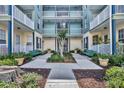 Inviting courtyard view featuring manicured greenery and shared seating arrangements at 611 Campus St # 160, Celebration, FL 34747