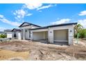 New construction featuring a white exterior, black roof, and open three car garage at 9241 Eagles Perch Pl, Orlando, FL 32825