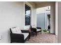 Cozy front porch featuring comfortable seating, offering a relaxing outdoor space and a welcoming ambiance at 14955 Lebeau Loop, Winter Garden, FL 34787