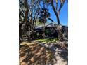 Restaurant exterior with a parking in rear sign, surrounded by lush trees and landscaping along the sidewalk at 724 Barrington Cir, Winter Springs, FL 32708